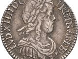 une pièce d'argent représentant une femme