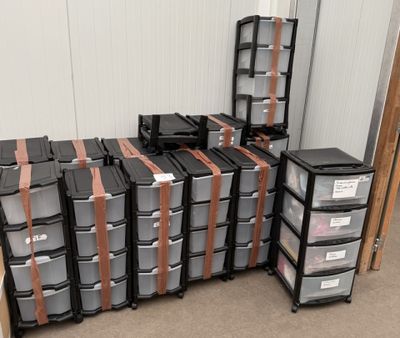 a lot of boxes that are stacked up in a room