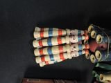 a group of small wooden toys that are on a table