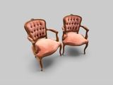 paire de fauteuils rembourrés en velours rose, aux accoudoirs sculptés