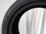 a close up of a tire on a white surface