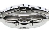 a close up of a watch on a white surface