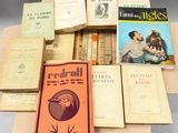 several books are stacked on top of each other on a table