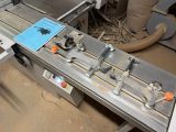 an image of a machine that is working on a piece of wood