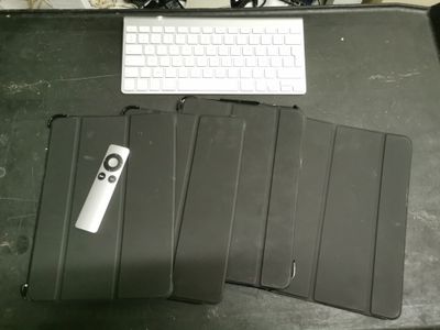 a keyboard and a mouse on a desk with a mouse pad