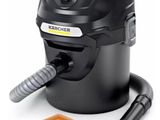a black vacuum cleaner with a cleaning brush and a cleaning cloth