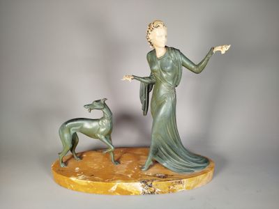 statue of a woman and a dog on a marble base