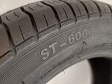 a close up of a tire on a white surface with a white background
