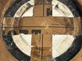 a picture of a piece of wood with a cross cut out of it