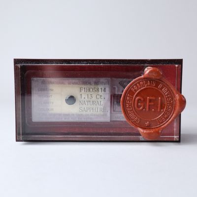 a wax seal that is sitting on top of a radio