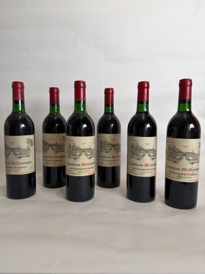 six bottles of wine are lined up on a table