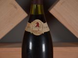 a bottle of wine that is sitting on a table