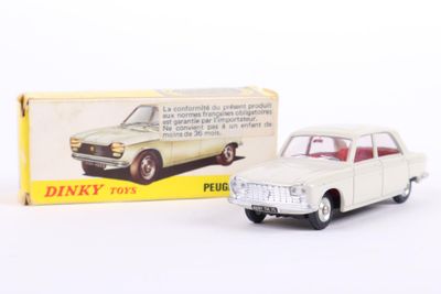 a toy car that is sitting next to a box