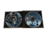they are two cds in a black case on a white background