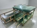 a glass table that has a lot of glass on top of it