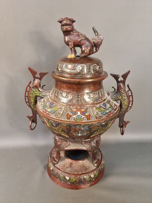 an image of a decorative vase with a dog on top