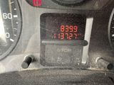 a digital clock on the dashboard of a car