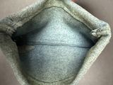 a person holding a bag with a zipper on it