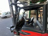 a fork lift truck parked on the side of the street