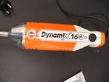 an orange and white vacuum that is on a table
