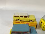 two toy cars that are sitting next to each other
