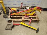 a pile of tools on a pallet in a warehouse