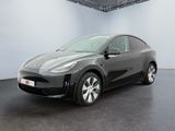 the tesla i - pace electric car is parked in a large room