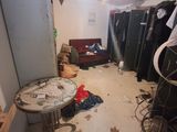 an image of a messy room with a lot of clutter on the floor