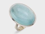 a close up of a ring with a blue stone in it