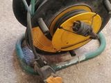 a hose that is sitting on the ground next to a hose