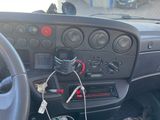 a car dashboard with a bunch of wires in it