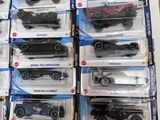 a lot of hot wheels cars on display on the table