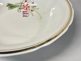 a plate with a flower design on it on a table