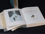 a book with a picture of a person riding a horse in the snow