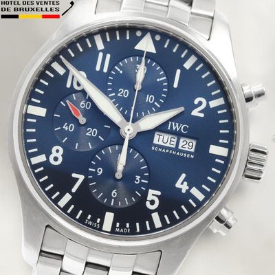 a close up of a wrist watch with a blue dial