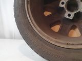 a close up of a tire on a white surface
