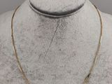 a gold necklace on a mannequin mannequin mannequin mannequin mannequin mannequin mannequin mannequin mannequin