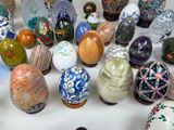 many different types of painted easter eggs on a table
