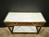 a marble top coffee table on a wooden base