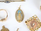 many different types of jewelry on a white surface