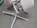 a machine that is sitting on the floor next to a bag