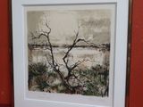 tableau représentant un arbre nu, encadré, sur un fond rouge