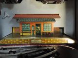 a model of a train station with a man on it