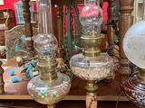 a lot of antique lamps on the table