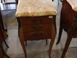 many tables and chairs in a room with a marble top