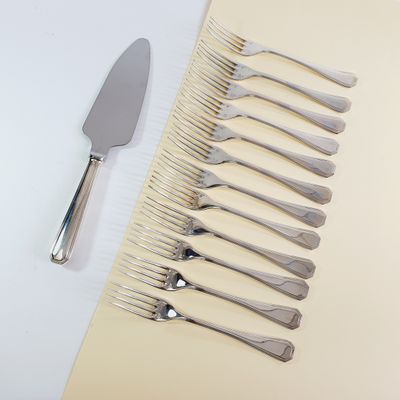 a lot of forks and a knife on the table