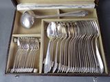 a lot of silver spoons and spoons in a box