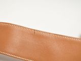 the belt is made of leather and has a metal buckle