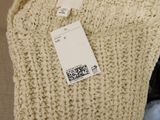 an image of a sweater with a price tag on it