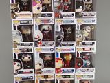 a close up of a bunch of pop vinyl figures in a display case